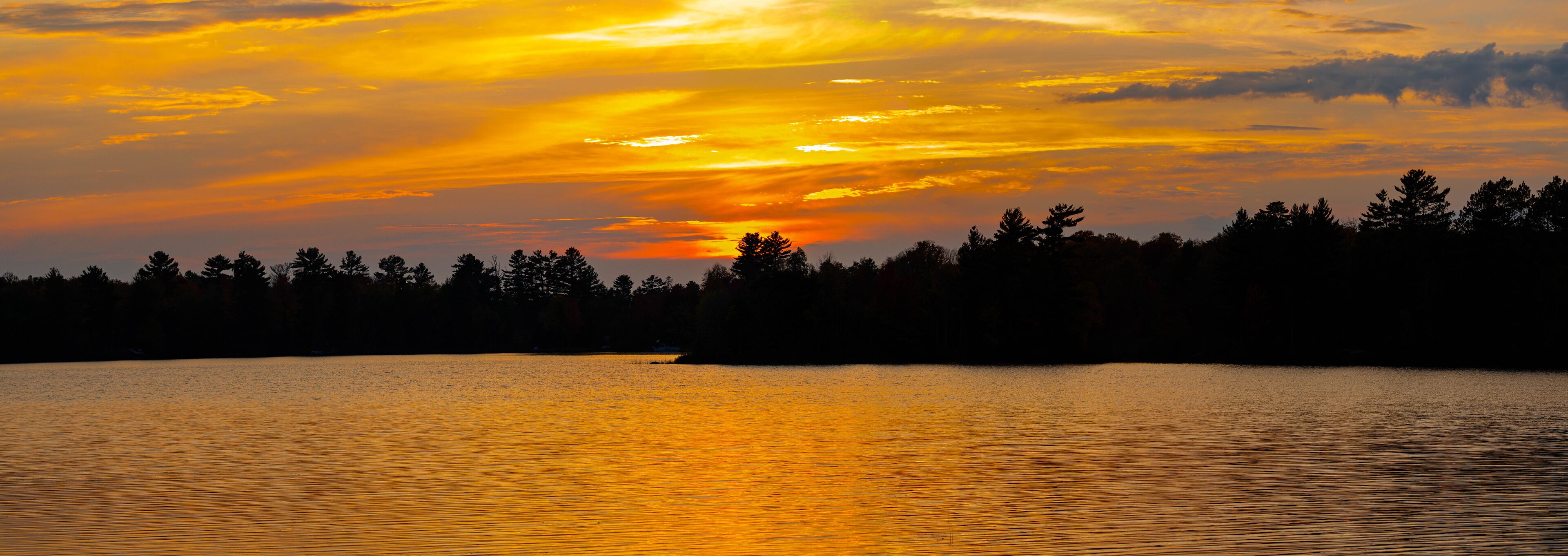Colorful sunset on lake of the Falls in Mercer, Wisconsin