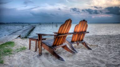 High Dynamic Range HDR Photo of wooden beach chairs along Lake Mendota at dusk Madison, Wisconsin