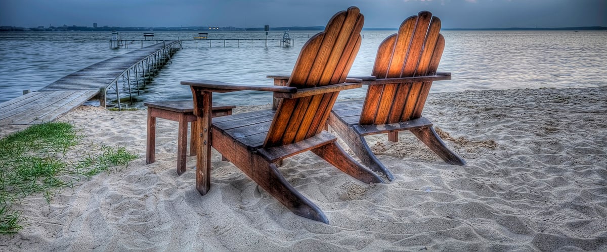 High Dynamic Range HDR Photo of wooden beach chairs along Lake Mendota at dusk Madison, Wisconsin