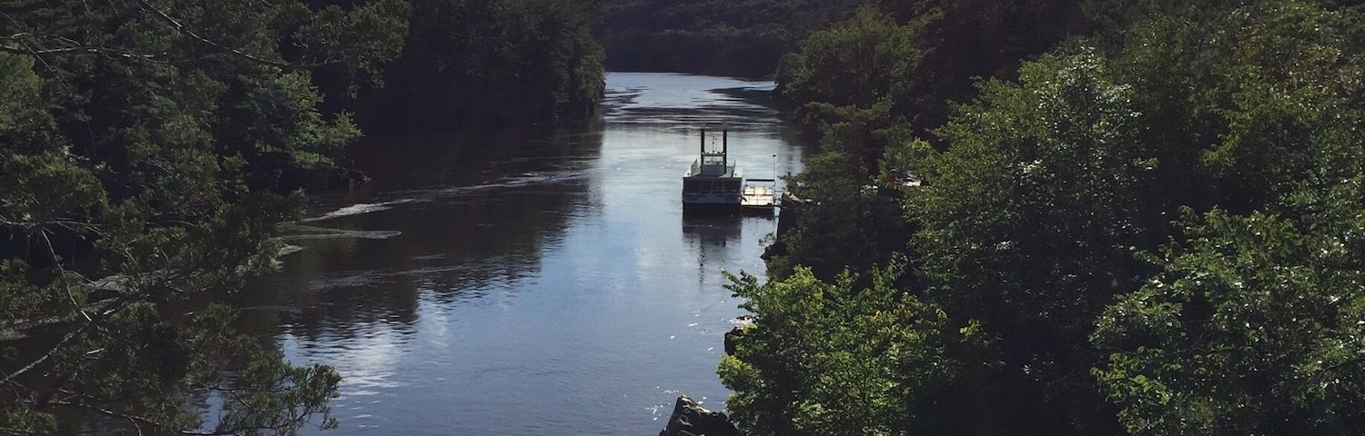 The Taylors Falls Princess docked just below Interstate Park in Taylors Falls. This view is from the glacial potholes trail. You can take a ride through the St. Croix River dalles and on down this peaceful river on one of two paddlewheels that leave from a spur on the parking lot at the potholes.