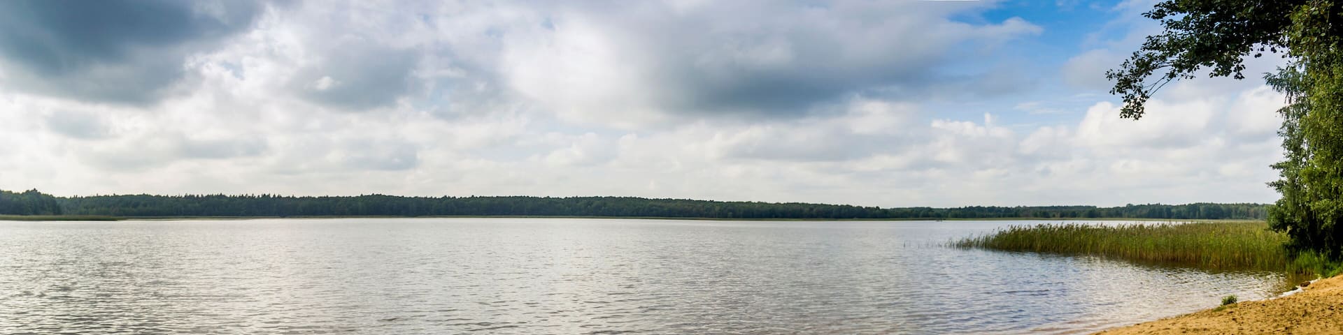 a three kayaks on the beach of Ostriv'yanske lake of Shatskyi Lakes group, Shatsk National Natural Park, Volyn region of Western Ukraine