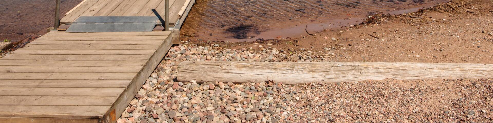 The small boat pier at Clear Lake State Park, Oneida County, Woodruff, Wisconsin in early June.