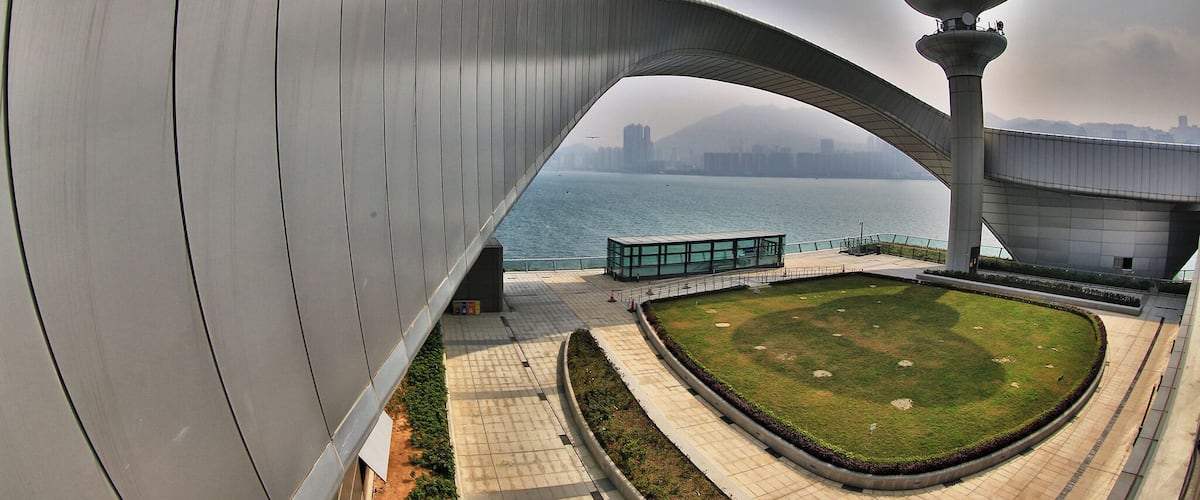 Built on the runway of the former Kai Tak Airport, the Kai Tak Cruise Terminal is an iconic structure centrally located in Hong Kong’s. The terminal is just opened in 2014 and its shops and restaurants open 365 days, and include travel retail, a wedding registry, and a 960-seat dim sum restaurant, Hong Kong cafe, Continental cuisine, Western cafe, and a wine and champagne bar.On the roof of the Terminal, there is a Park which occupies an area of 23,000 square metres with passive amenities including a central lawn, a viewing platform, water garden, fountain plaza, etc. It is a new place with modern facilities which worth to visit when travelling Hong Kong via Cruise or other means. #architecture