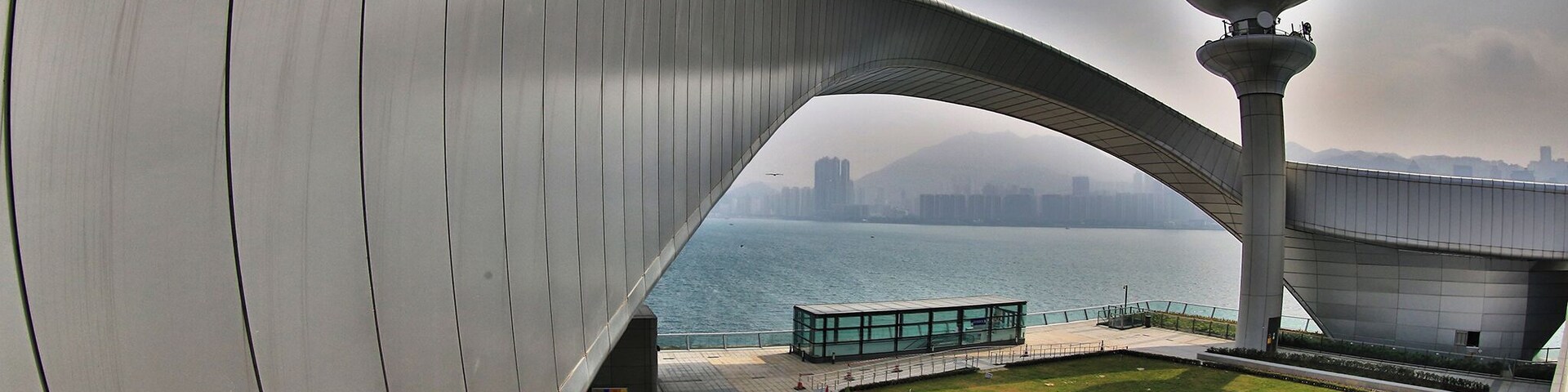 Built on the runway of the former Kai Tak Airport, the Kai Tak Cruise Terminal is an iconic structure centrally located in Hong Kong’s. The terminal is just opened in 2014 and its shops and restaurants open 365 days, and include travel retail, a wedding registry, and a 960-seat dim sum restaurant, Hong Kong cafe, Continental cuisine, Western cafe, and a wine and champagne bar.On the roof of the Terminal, there is a Park which occupies an area of 23,000 square metres with passive amenities including a central lawn, a viewing platform, water garden, fountain plaza, etc. It is a new place with modern facilities which worth to visit when travelling Hong Kong via Cruise or other means. #architecture