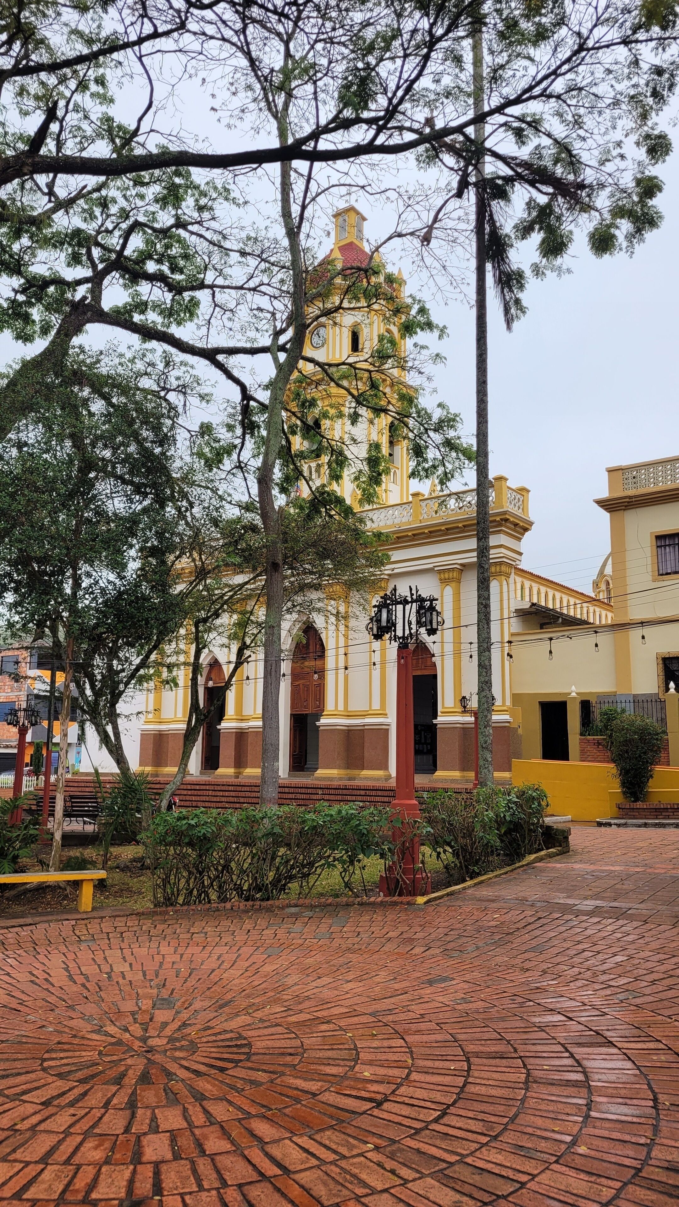 Colonial church with bell tower overlooking a brick plaza, in palmira - san cristobal, venezuela