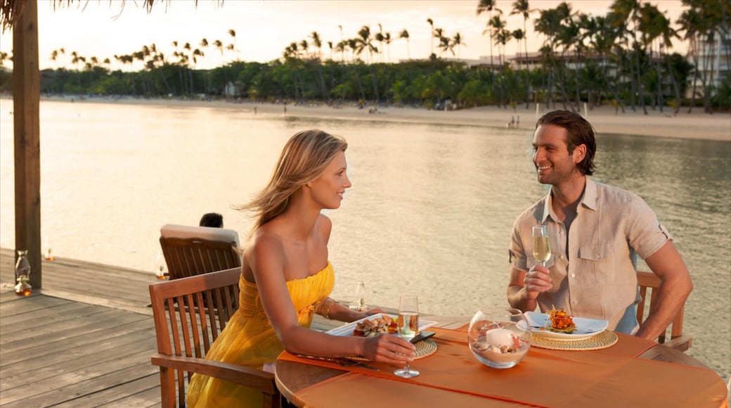 Juan Dolio which includes outdoor eating and general coastal views as well as a couple