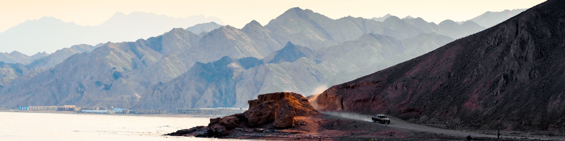 car rides on a road in the mountains near the shores of the Red Sea in Egypt