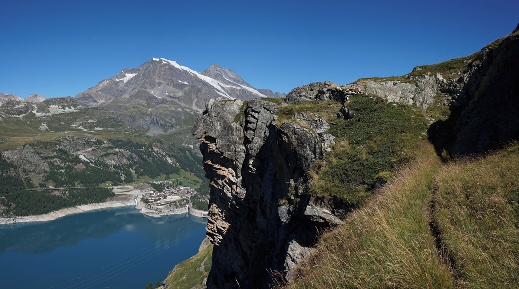 Cliff and lake Lac du Chevril in Tignes.