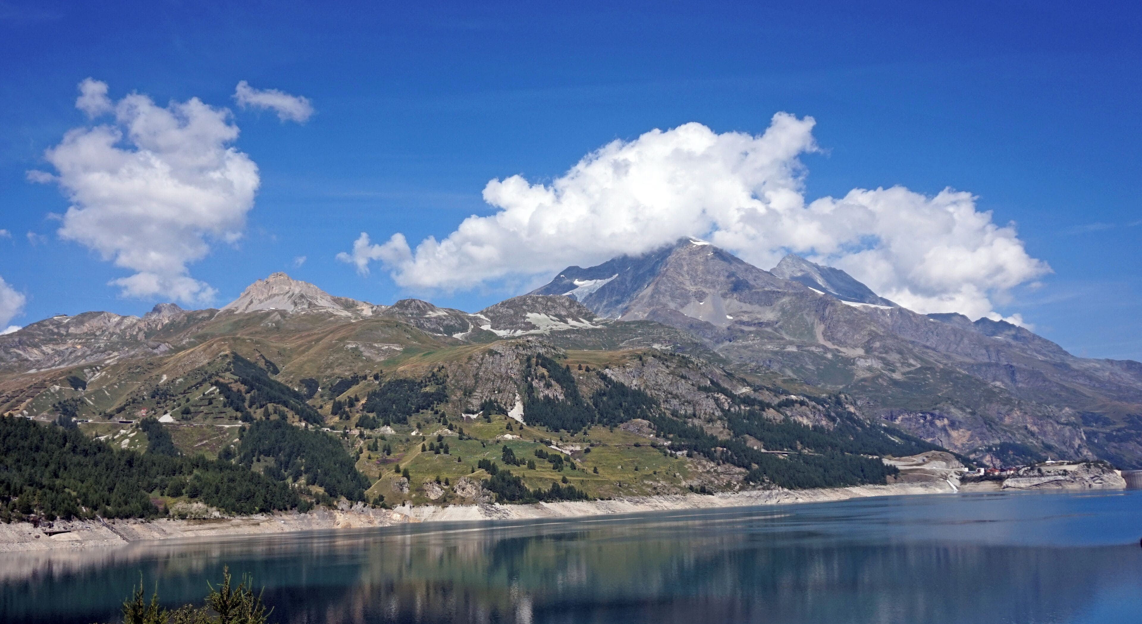 View over the lake Lac du Chevril towards mountain near Tignes.