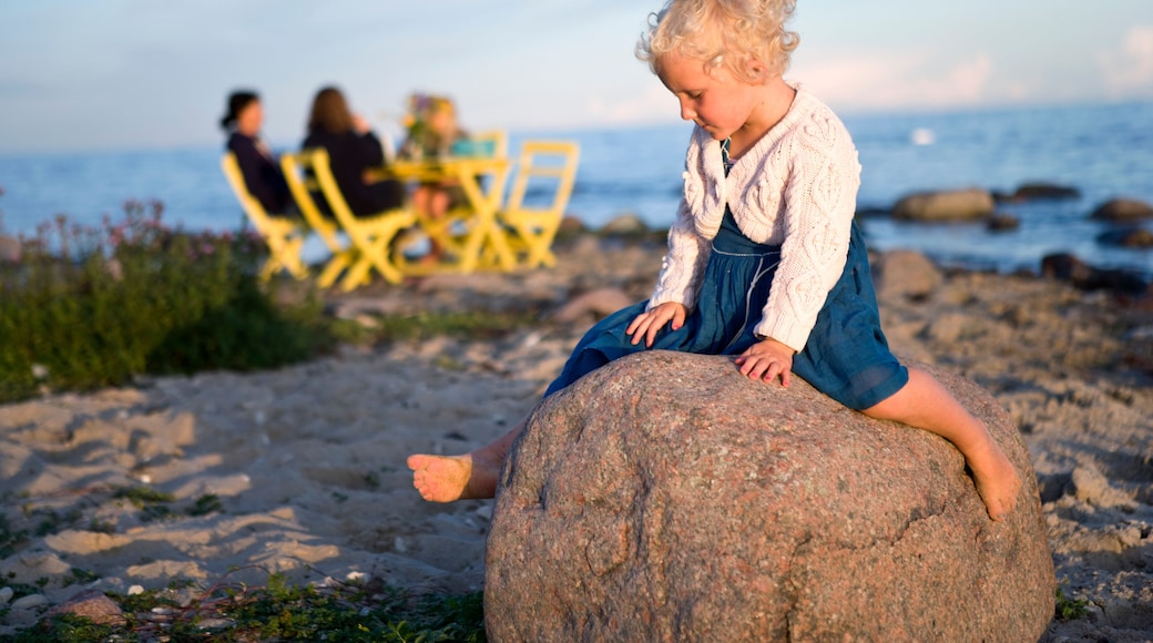 A girl sitting on a rock, Oland, Sweden.