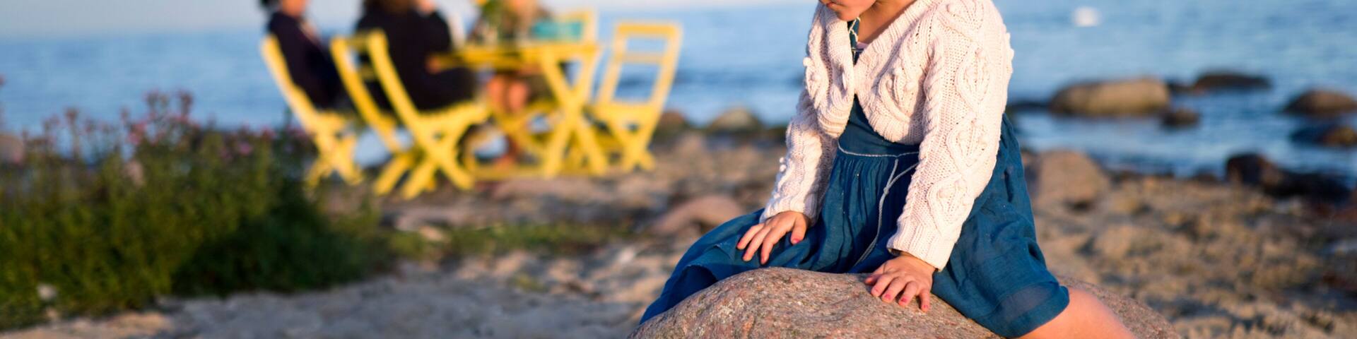 A girl sitting on a rock, Oland, Sweden.