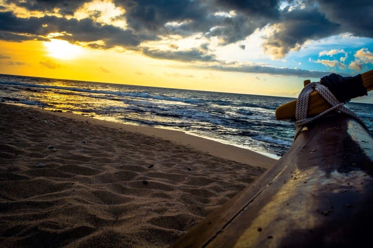 #TroverDetour last month while on the big island taking a picture of the sun peaking from the clouds with the outrigger of a dragon boat in the foreground