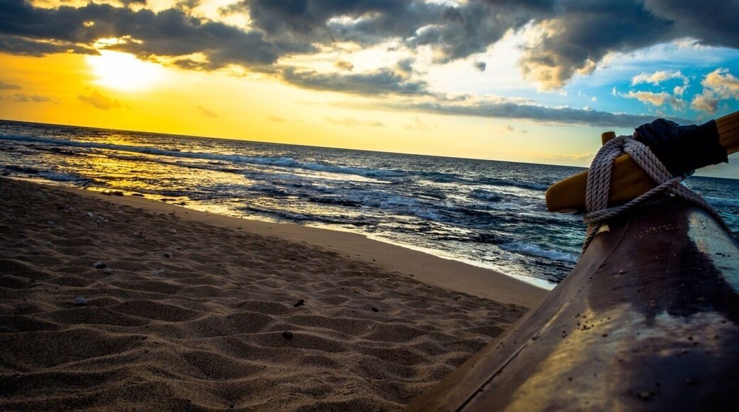 #TroverDetour last month while on the big island taking a picture of the sun peaking from the clouds with the outrigger of a dragon boat in the foreground