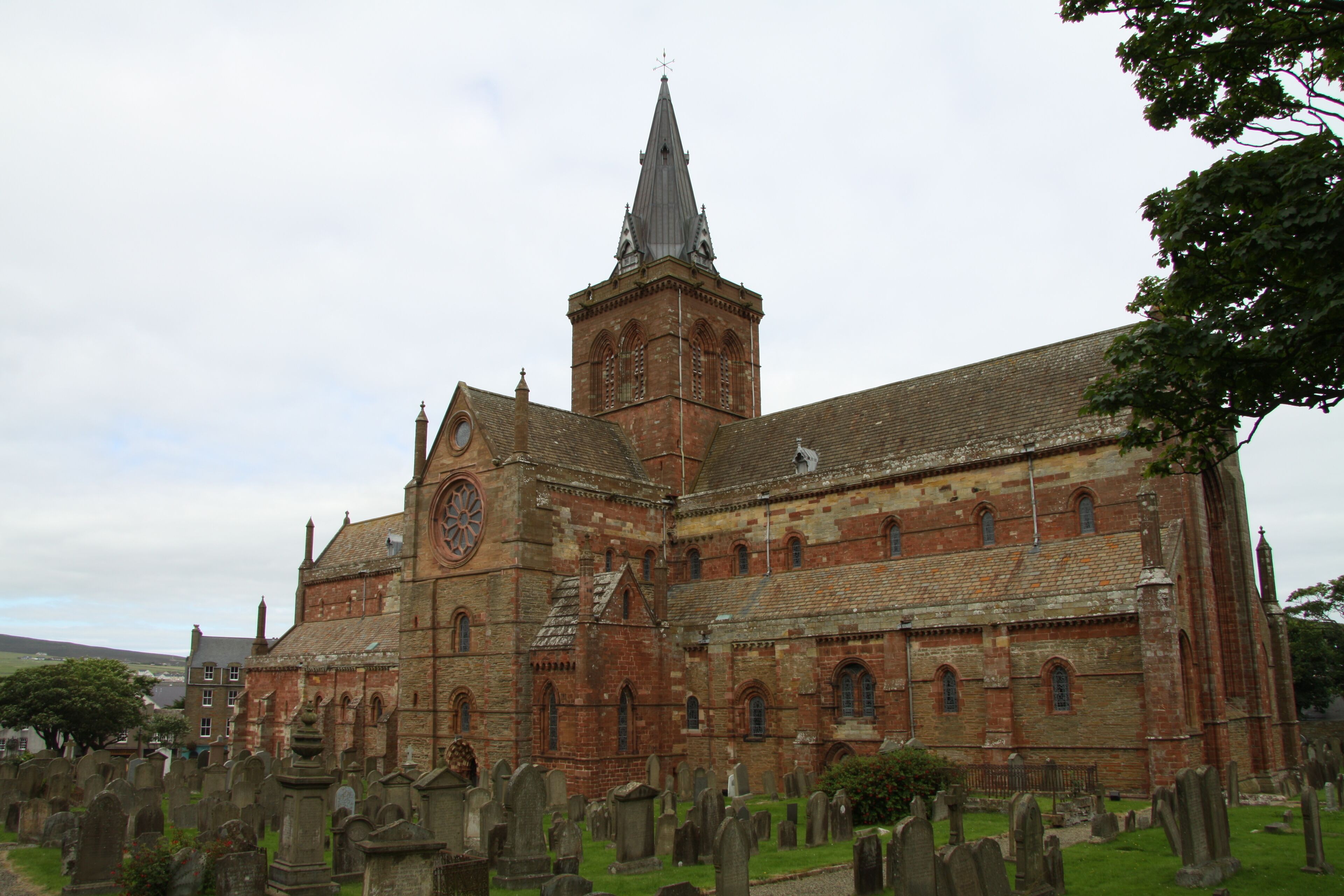A historic church with a prominent tower and a large clock.