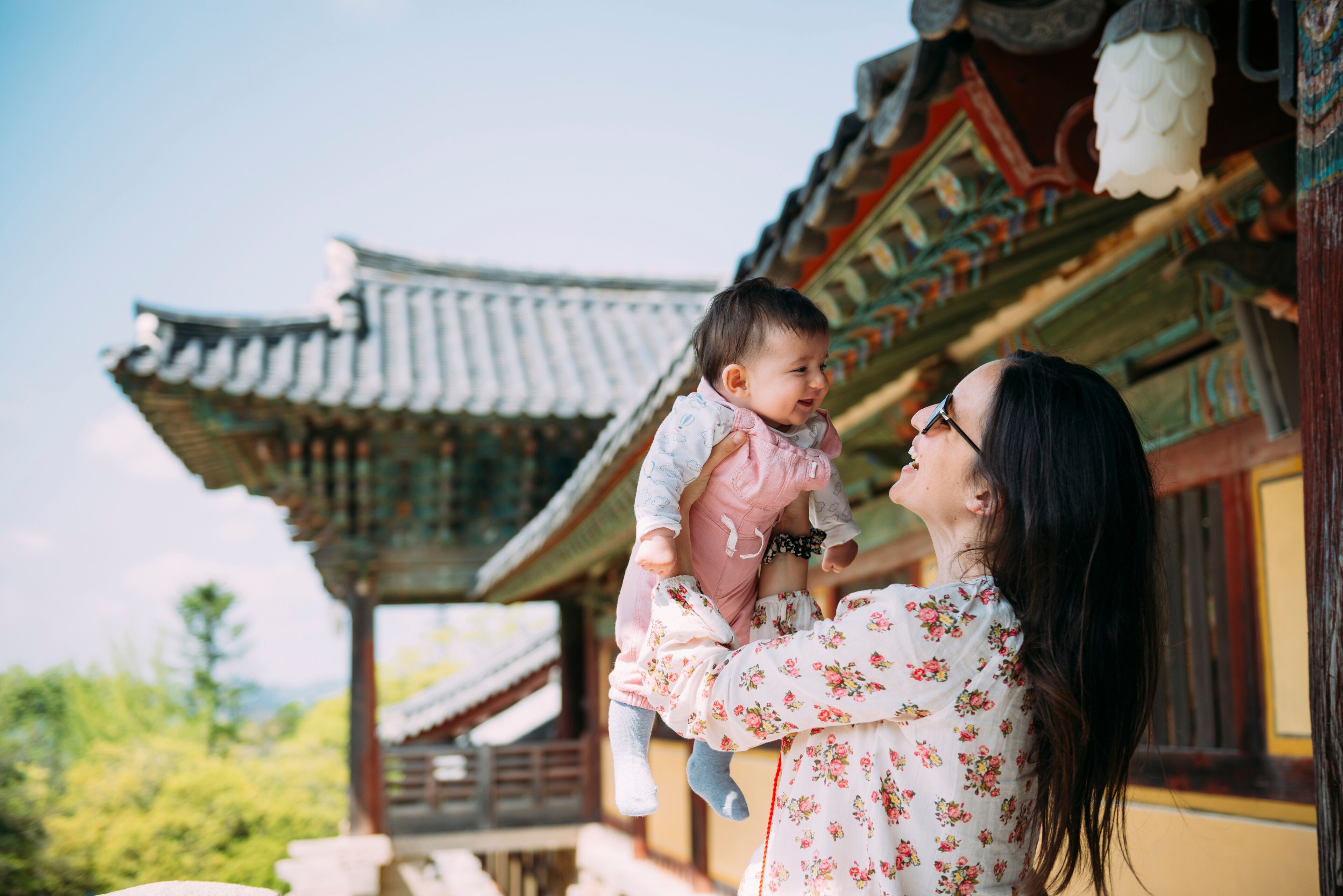 South Korea, Gyeongju, woman traveling with a baby girl in Bulguksa Temple