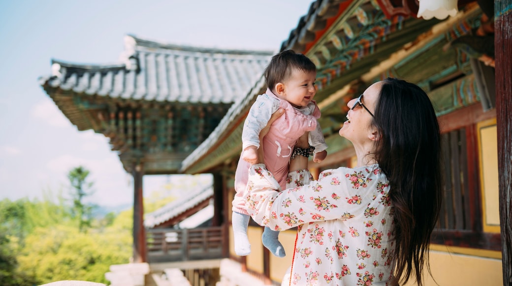 South Korea, Gyeongju, woman traveling with a baby girl in Bulguksa Temple