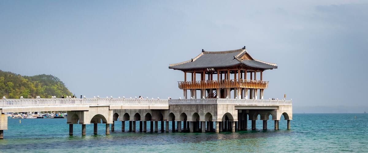 Brown traditional Korean pagoda on the blue waters off the coast of Pohang South Korea