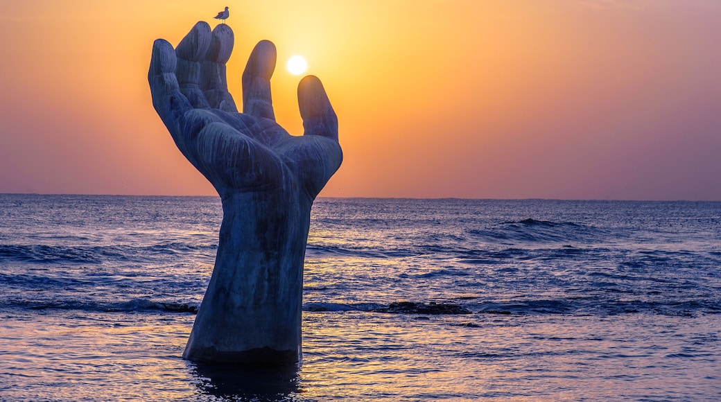 Sunrise at the giant hand at Homigot Beach, Pohang, South Korea. 8 February 2019