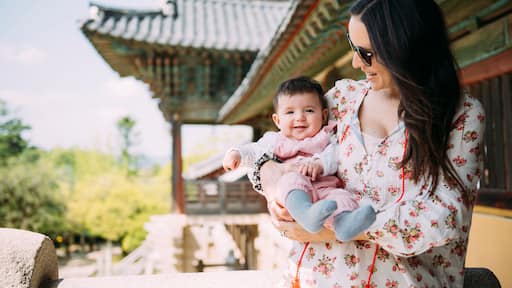 South Korea, Gyeongju, woman traveling with a baby girl in Bulguksa Temple