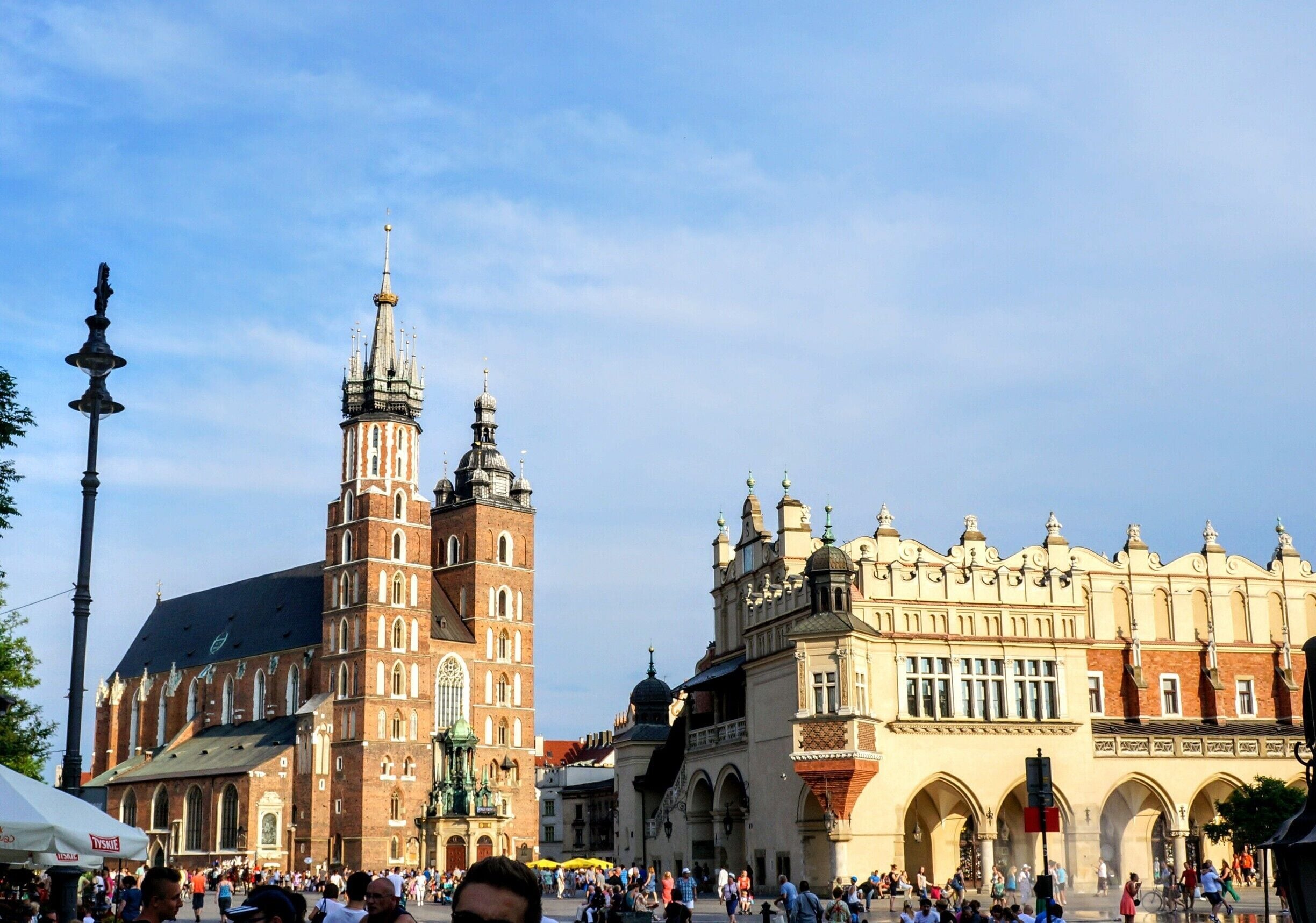 The main square of the old town of Krakow is in located at the center of the city. It dates back to the 13th century, and at roughly 40,000 m2 is one of the largest medievel town squares in Europe. In the center of the square in the picture on the right is the the cloth hall rebuilt in 1555 in Renaissance style. In the back is the St. Mary's Basilica.