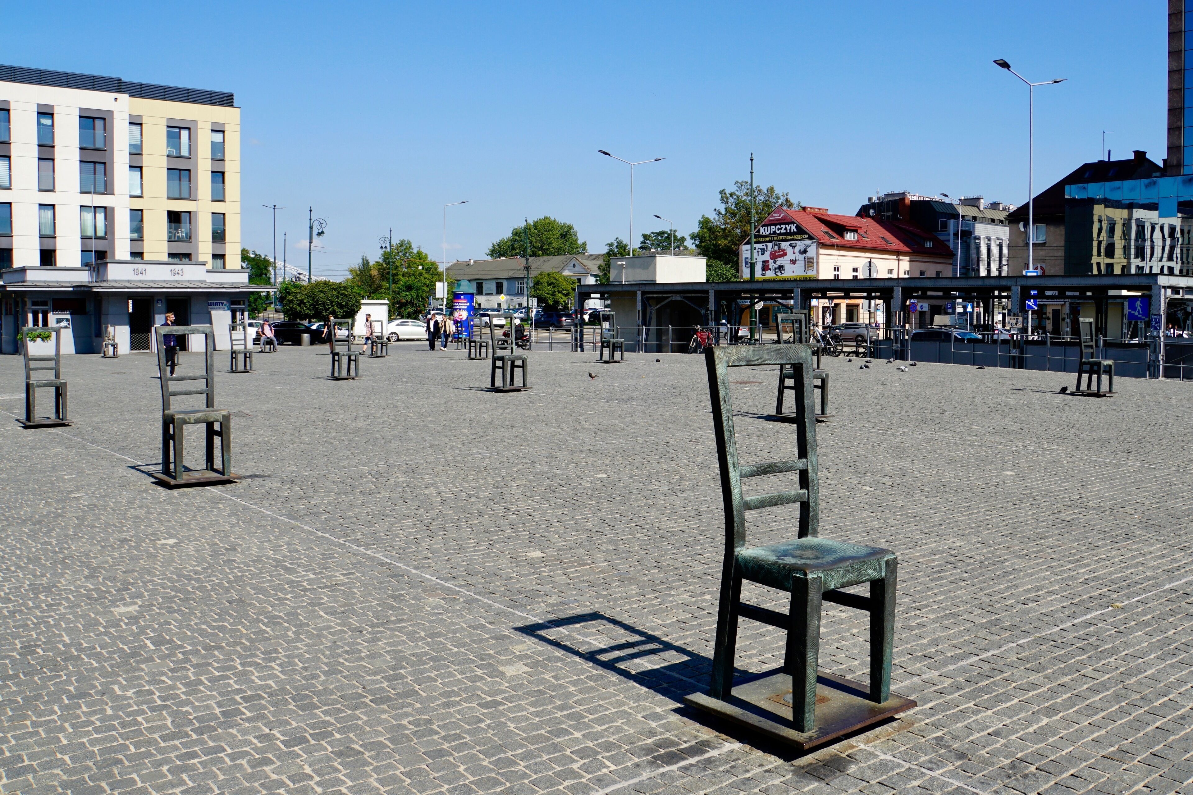 Some of the 70 empty metal chairs @ Plac Bohaterow Getta, Podgorze, Krakow, Poland (Sep 2019): these chairs have stood there since 2005 in memory of the fate that awaited many thousands of Jews deported from the Krakow Ghetto to the extermination camps during World War II.
