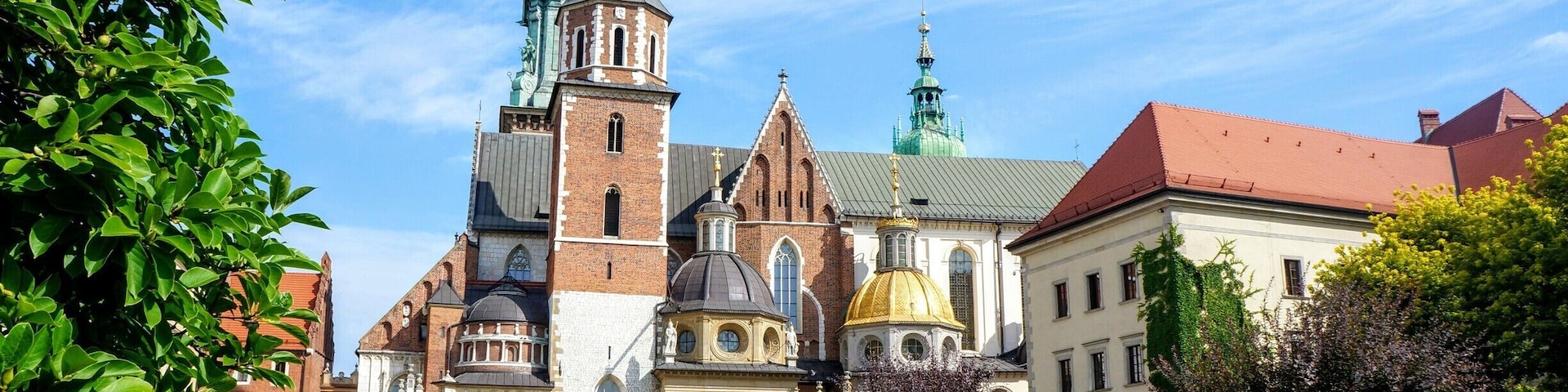 Wawel Cathedral inside Wawel Royal Castle. Surrounded with brick wall an aosis of green garden and it Feels like a private church. And you can't believe youre so close to the city.