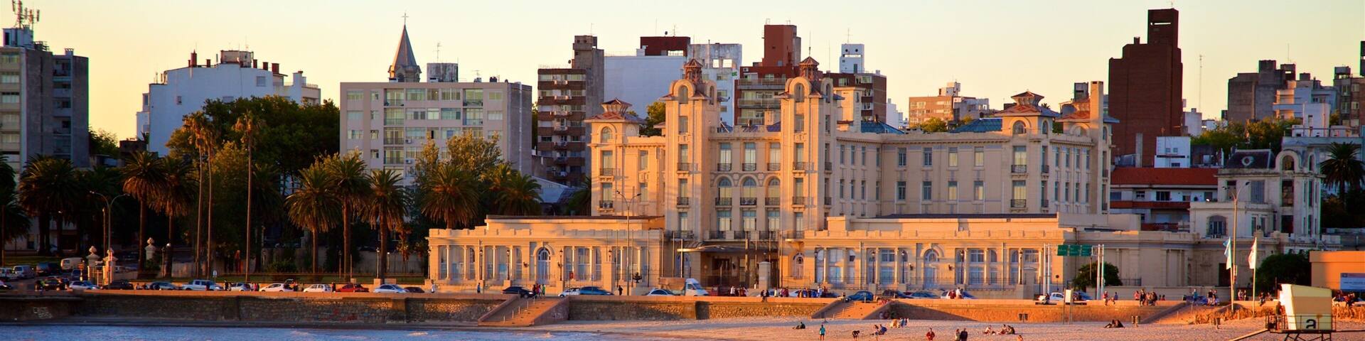 Uruguay showing general coastal views, a sunset and a city