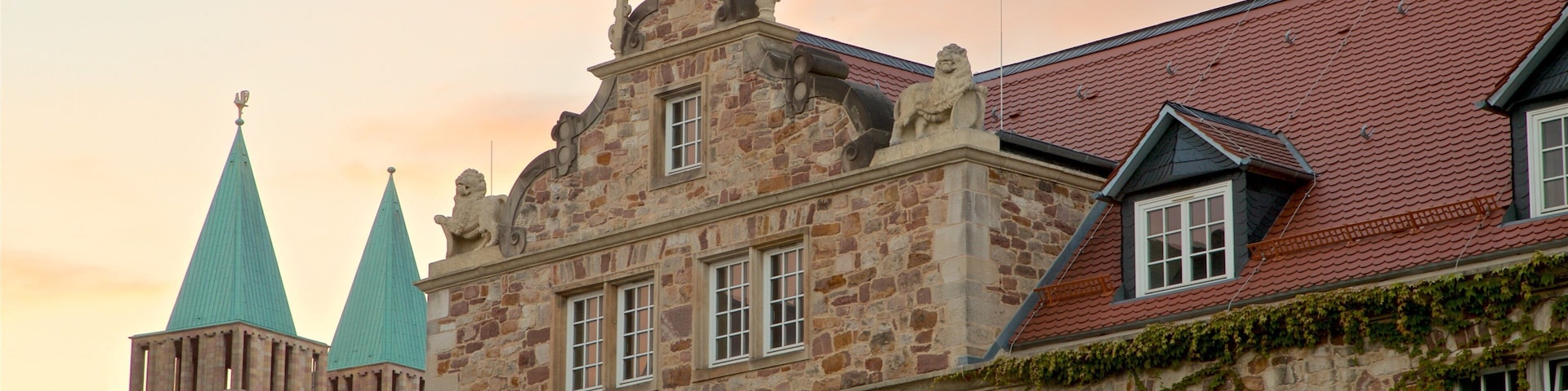 Kassel featuring heritage architecture and a sunset