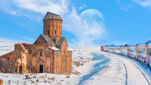 Red diesel train (East express) in motion at the snow covered railway platform - Ani Ruins, Ani is a ruined and uninhabited medieval Armenian city "Elements of this image furnished by NASA "