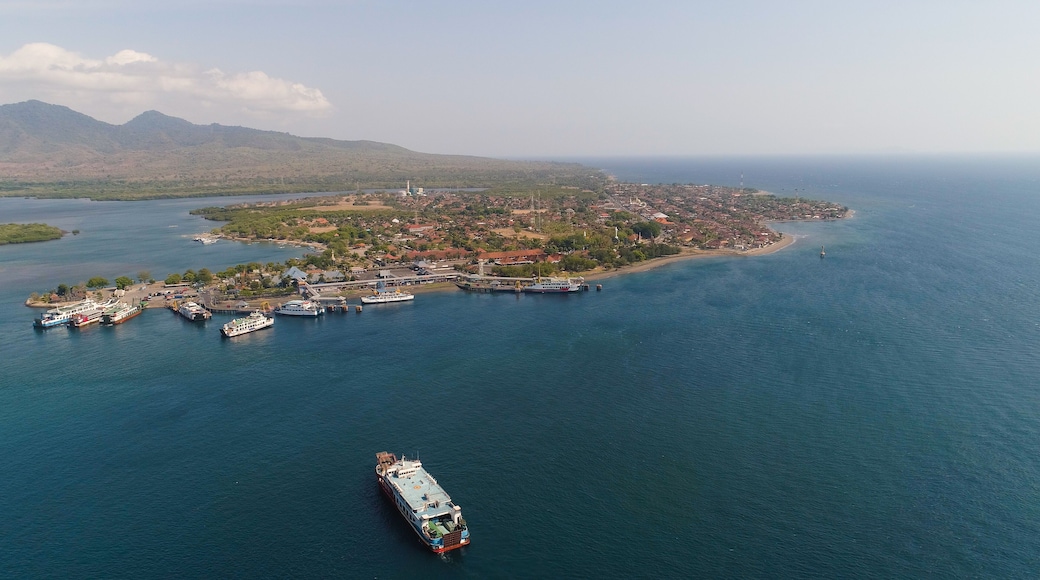 Aerial view ferry port gilimanuk with ferry boats, vehicles. Ferries transport vehicles and passengers in port. Port for departure from Bali to the island of Java.