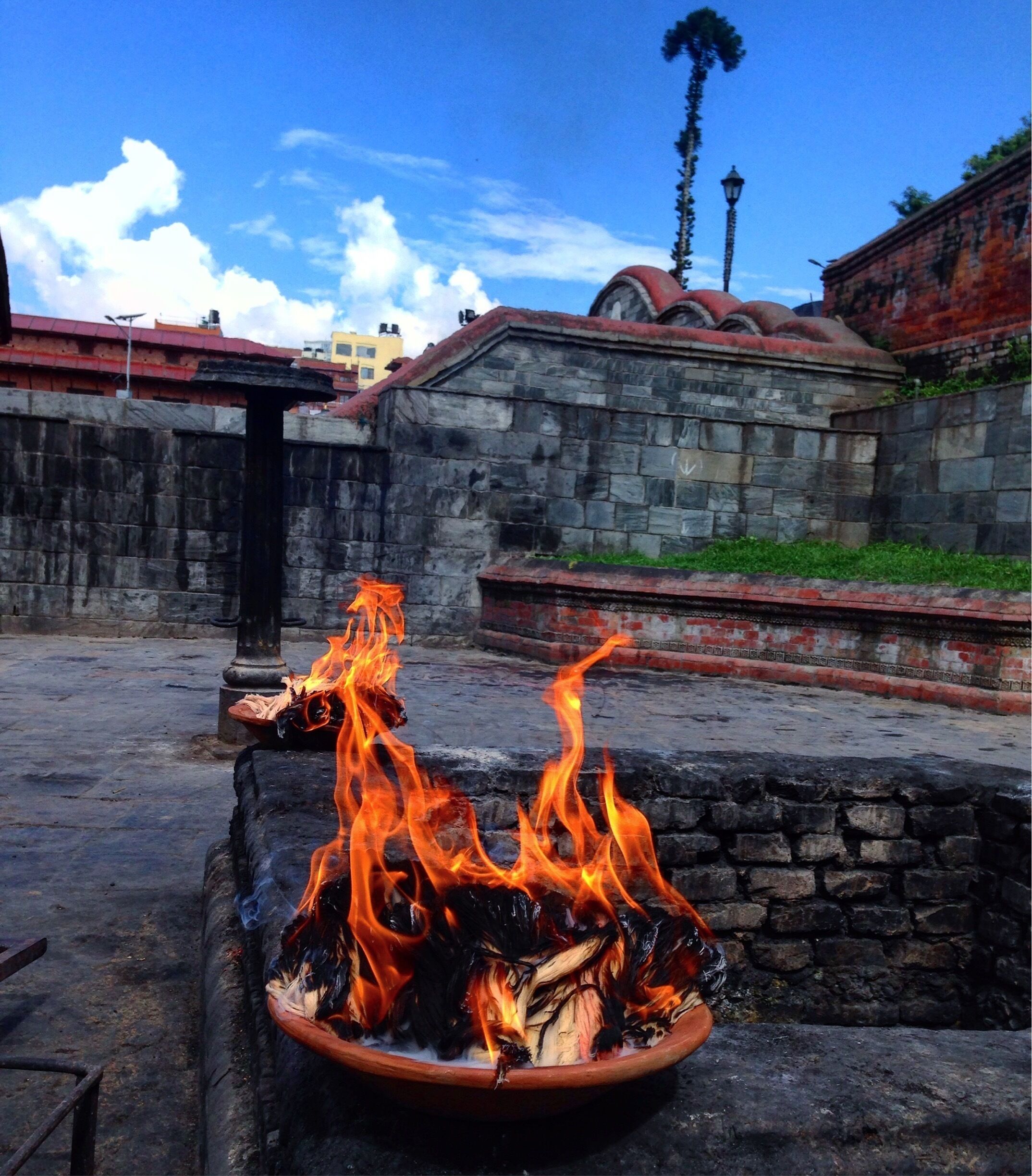 Burning your ego and sins before entering the temple. Humility is everything. 