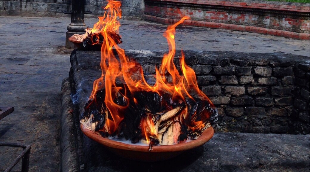 Burning your ego and sins before entering the temple. Humility is everything.