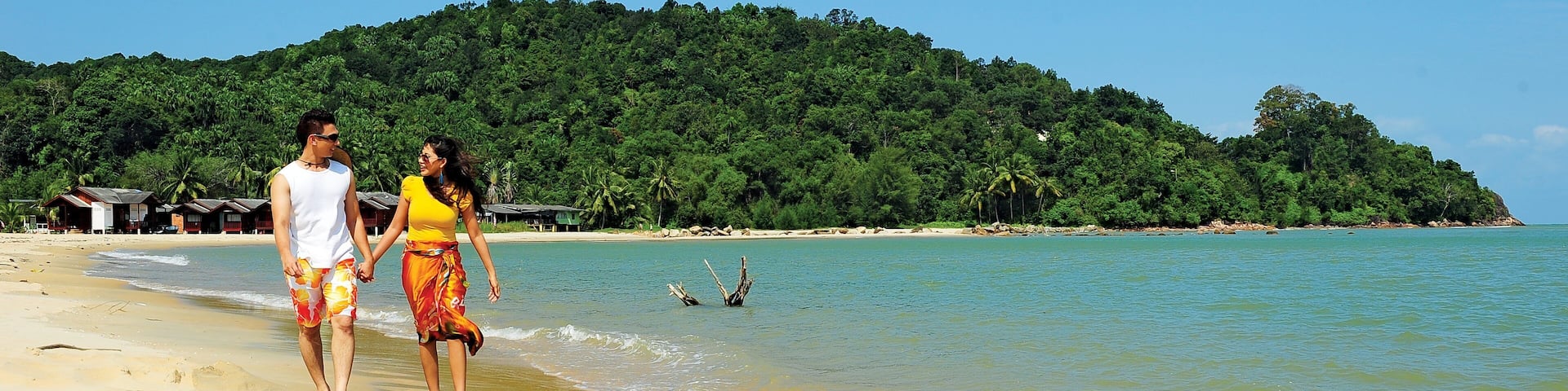 Kuantan which includes a beach and general coastal views as well as a couple