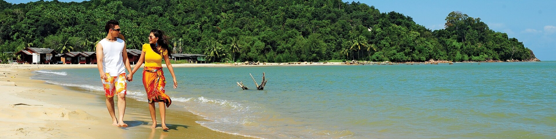 Kuantan which includes a beach and general coastal views as well as a couple