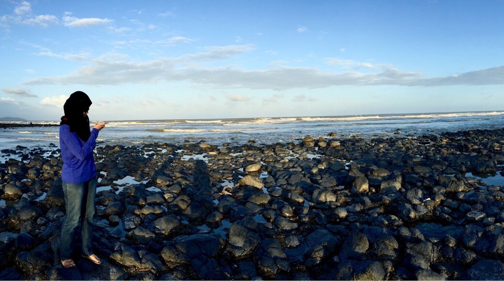 If you in Kuantan Pahang then you might want to come to this beach; pantai balok with black stones. It takes around half an hour drive from Kuantan. Black stone Balok Beach, Kuantan, Pahang, Malaysia