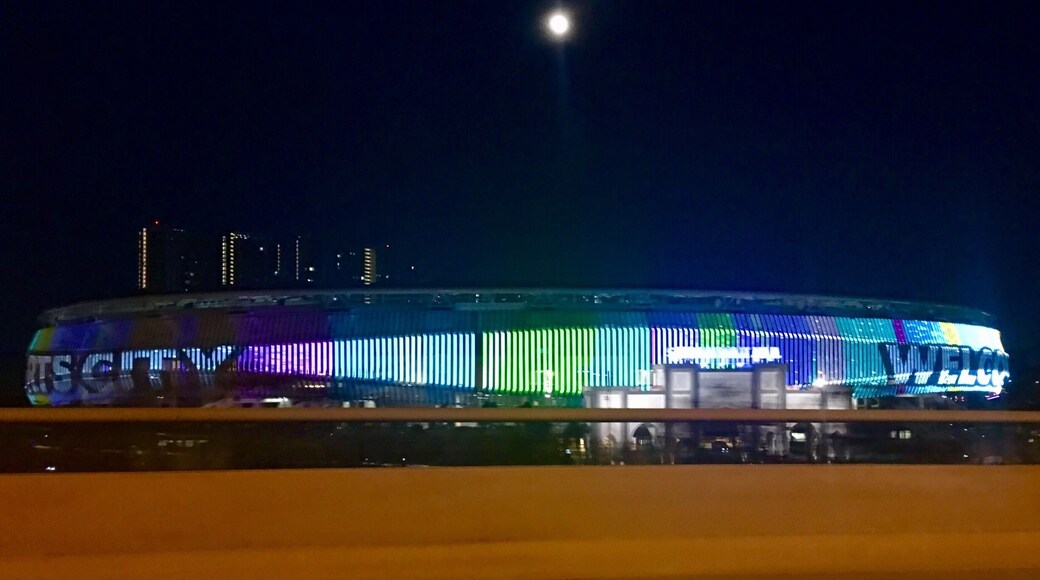 The playful display of colourful LED lights illuminate KL Sports City as the full moon illuminates the sky above it. #klsportscity.my #stadium_bukitjalil #dusk #led display #led #kualalumpur #malaysia #travelblogger #mariadasstheworld