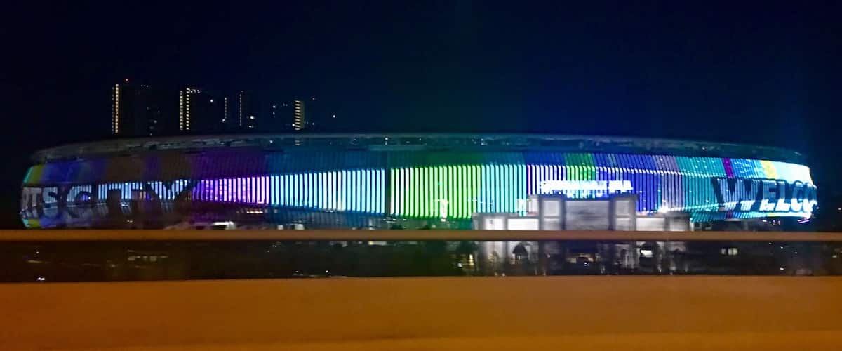 The playful display of colourful LED lights illuminate KL Sports City as the full moon illuminates the sky above it. #klsportscity.my #stadium_bukitjalil #dusk #led display #led #kualalumpur #malaysia #travelblogger #mariadasstheworld