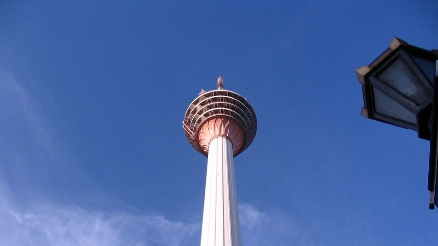 The Kuala Lumpur Tower is a tall tower located in Kuala Lumpur, Malaysia. Its construction was completed on 1 March 1995. It is used for communication purposes and features an antenna that reaches 421 metres. The roof of the pod is at 335 metres