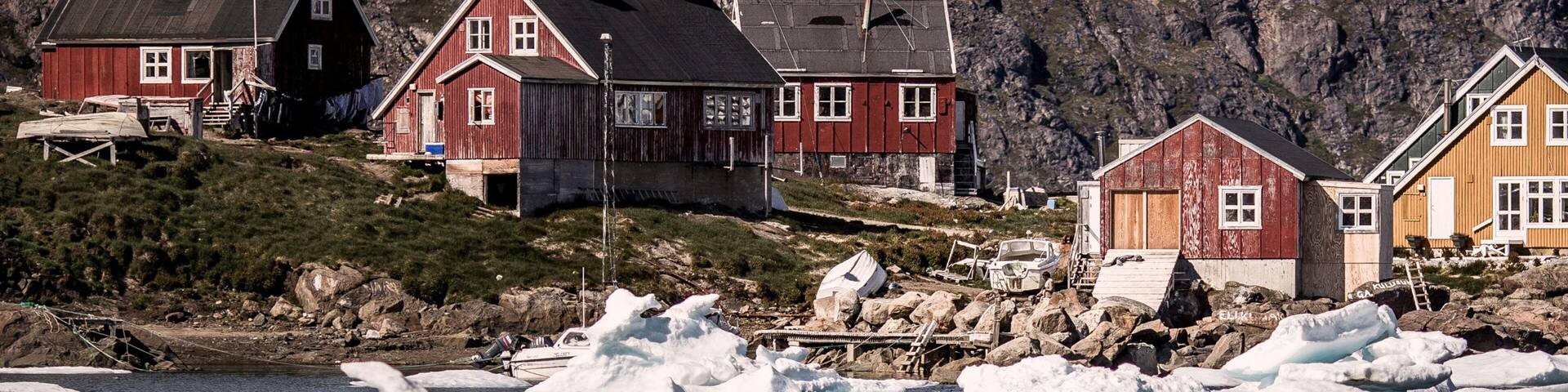 Kulusuk showing a lake or waterhole, a small town or village and mountains