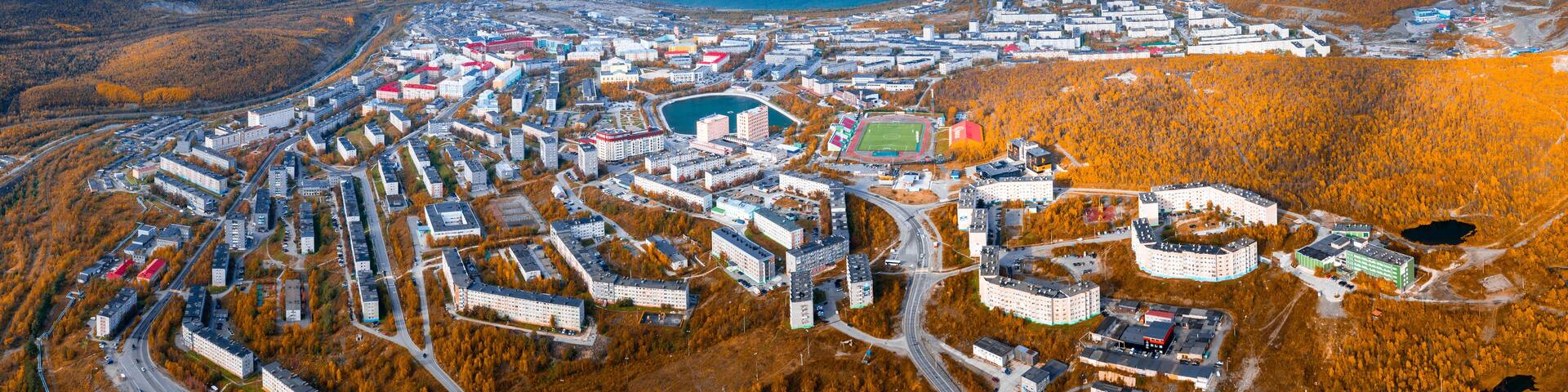 Aerial view of the town of Kirovsk surrounded by Khibiny mountains in Russia