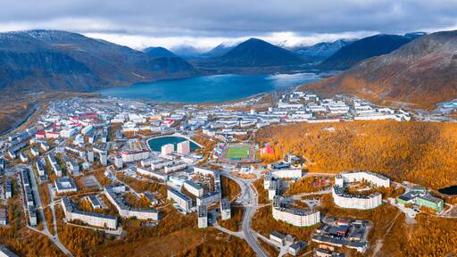 Aerial view of the town of Kirovsk surrounded by Khibiny mountains in Russia