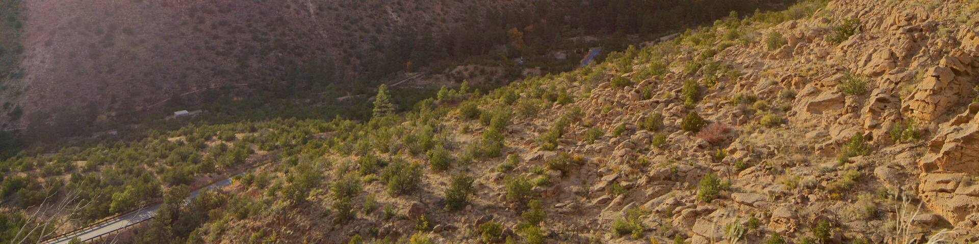 A canyon with a road running through it.
