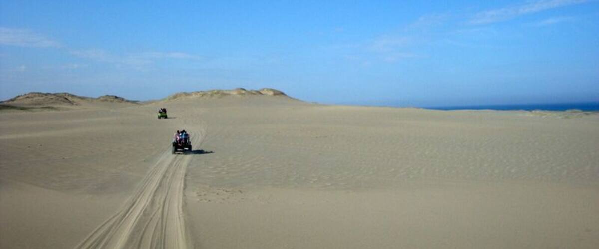 A sand dune, you may think it's all sand and it's boring. But I saw the layers of #blue and it became the highlight of our trip!
You can see the clear sky and the ocean (peeking on the right side of the photo!) while you enjoy a thrilling 4x4 ride. 
Also some amazing local residents/young tourist guides/photographers are waiting to take your perfect sand boarding and jump shot! How cool is that?