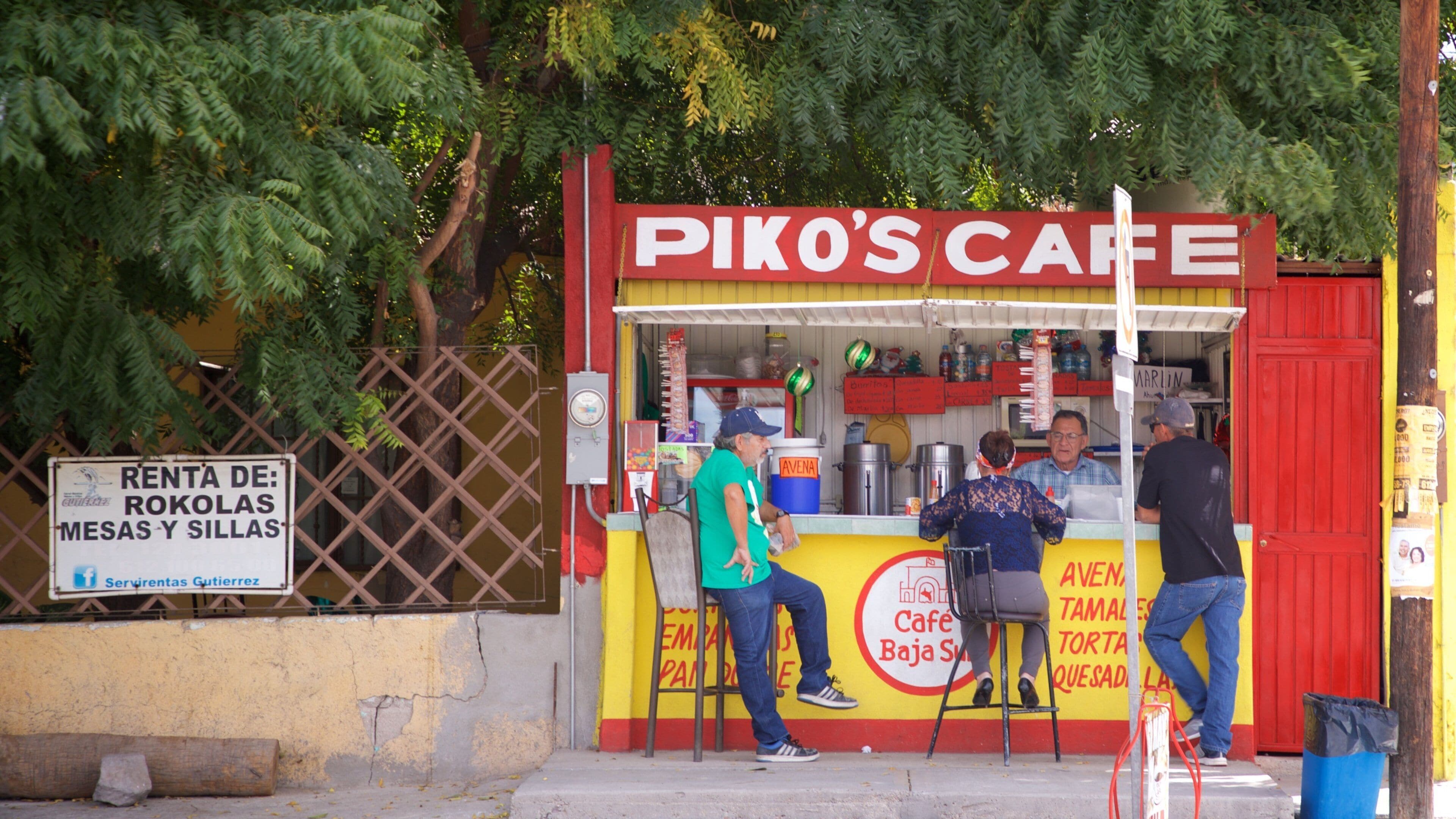 La Paz which includes signage and outdoor eating as well as a small group of people