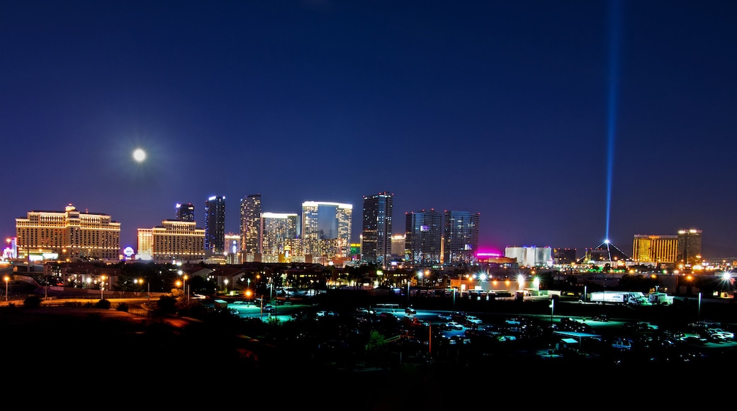 A view of the Las Vegas skyline with a full moon shining down.