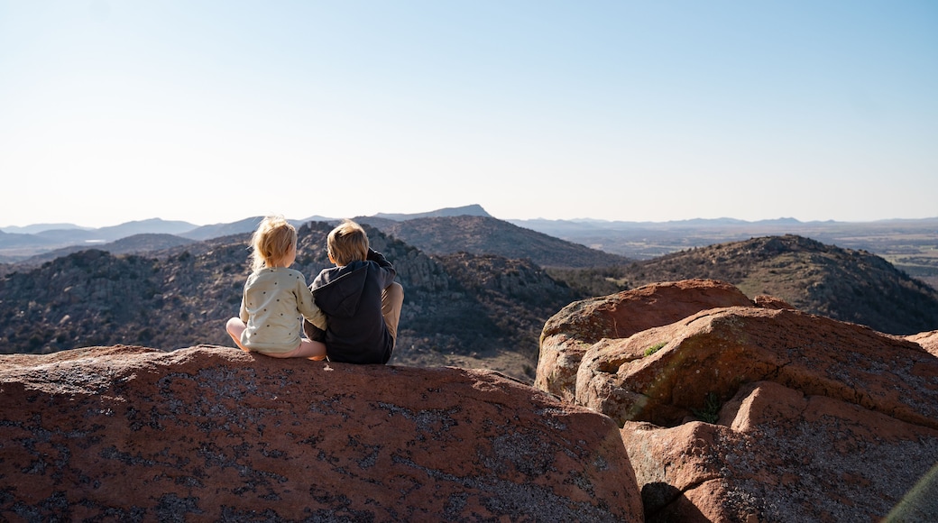 Children Sitting On Mountain Top In Wichita Mountain Wildlife Refuge