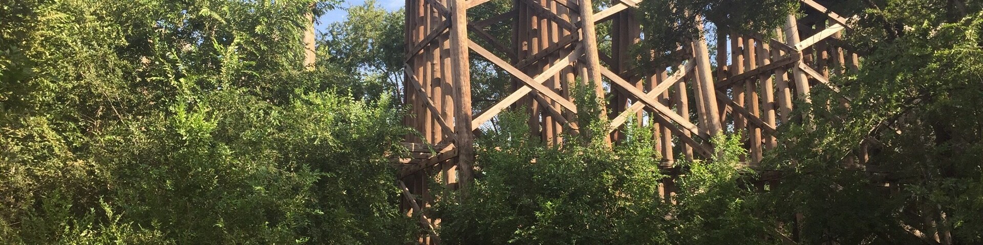A trail runs under an old railroad bridge on the south end of Dunbar Park. This location is claimed to be a hotspot for paranormal activity and several ghost hunting crews have deemed the location Hell's Gate. Supposedly old western train robbers would dump bodies here, the site has also been notorious for suicides and devil worship. Personally I found it a peaceful trail under an enchanting bridge, of course I never ventured through at night.