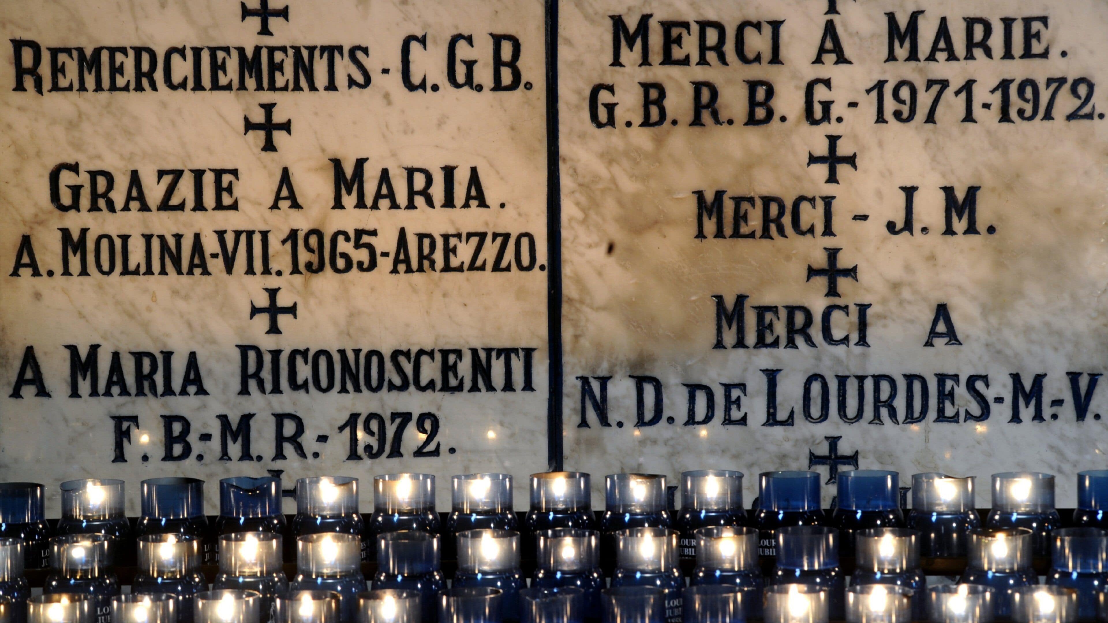 Lourdes which includes signage and interior views