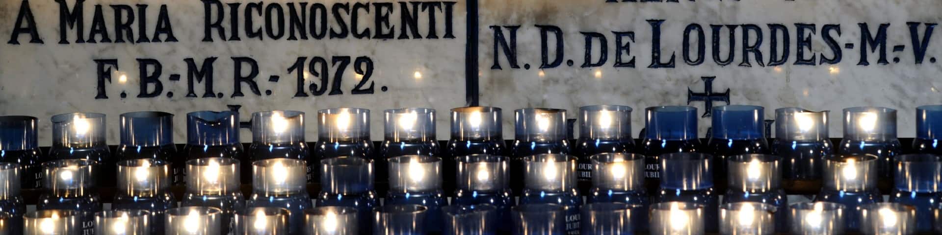 Lourdes which includes signage and interior views