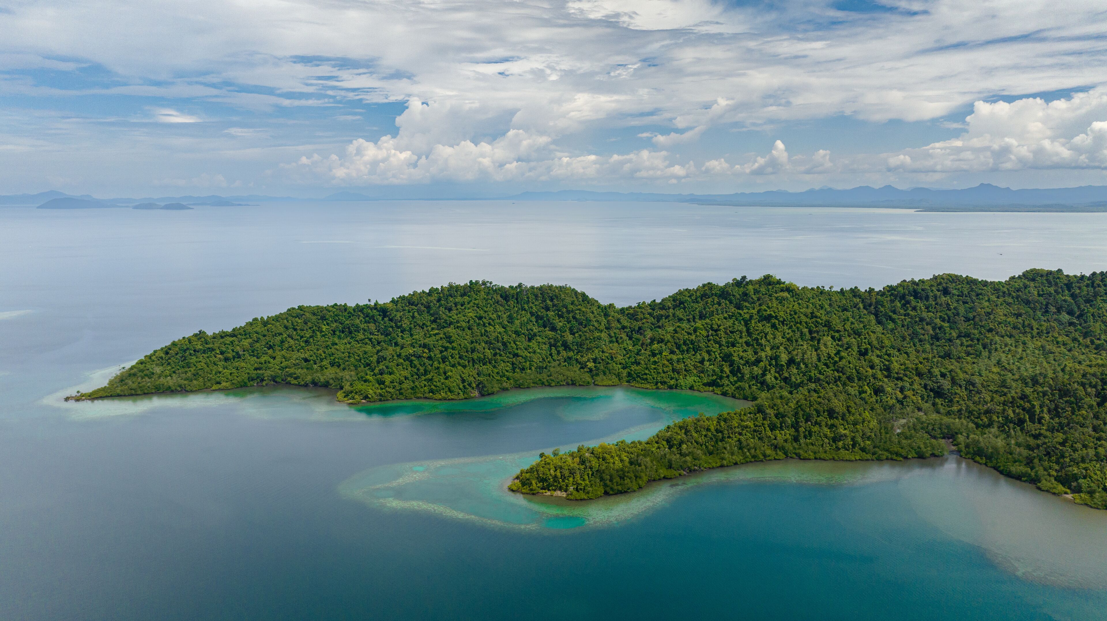 Aerial drone of tropical islands with lagoons. Seascape in the tropics. Borneo, Sabah, Malaysia.